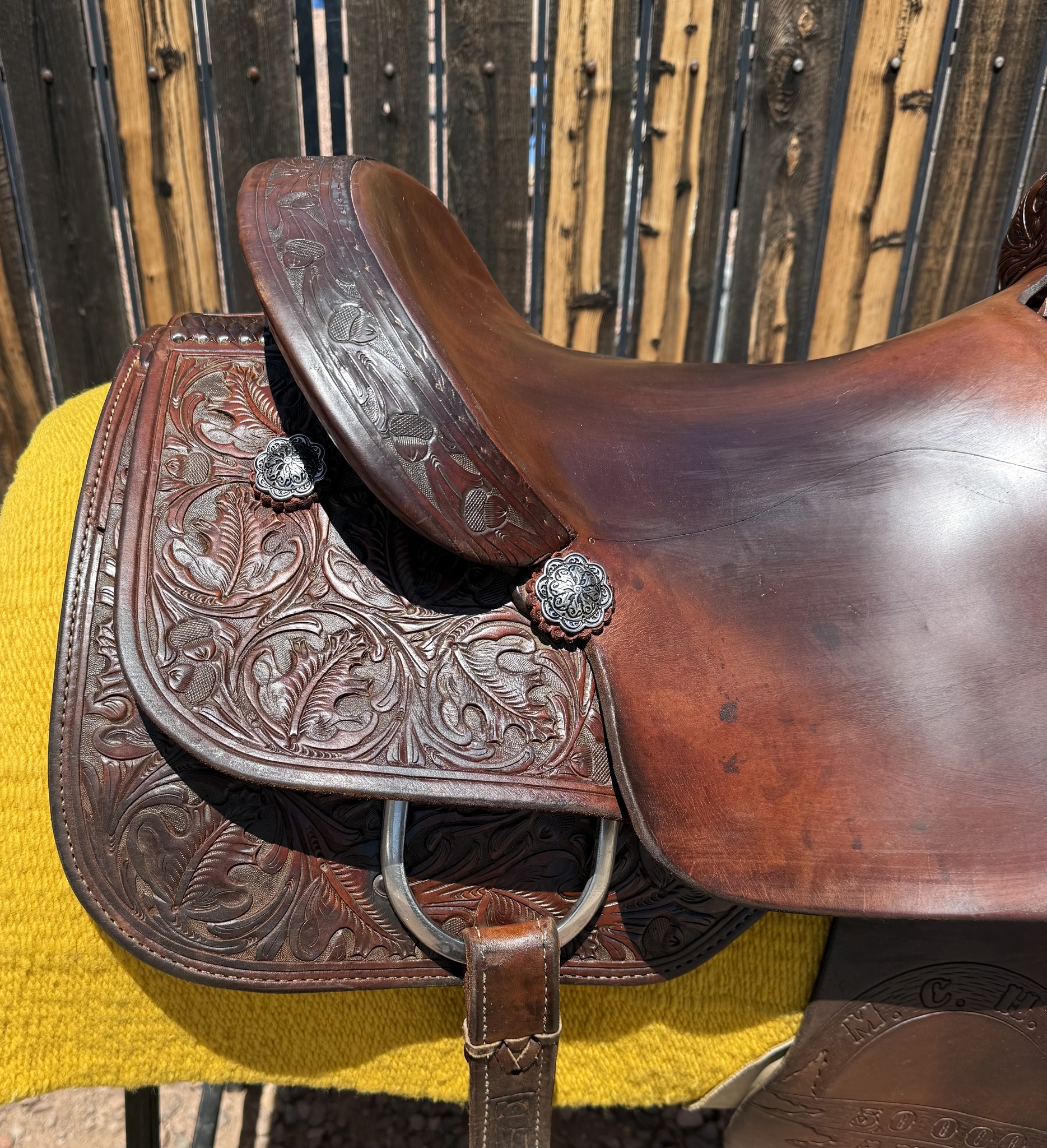 Teddy Johnson Cutter — cantle left side silver conchos